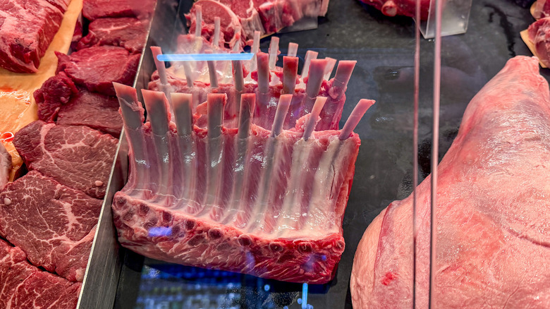 Racks of lamb in grocery store meat case