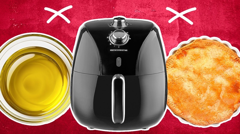 Air fryer with oil and a pie on either side of it