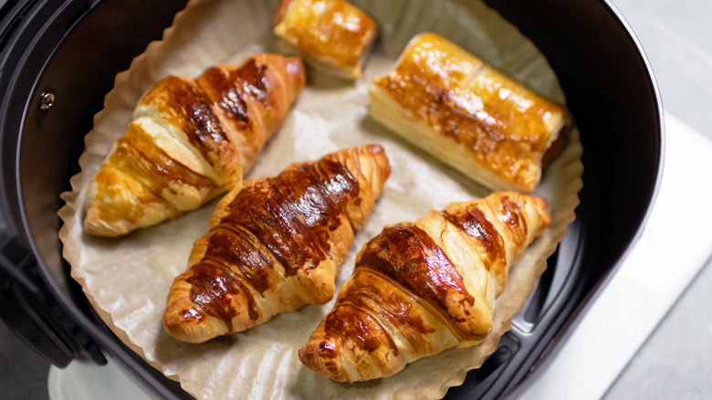 Croissants baking in an air fryer