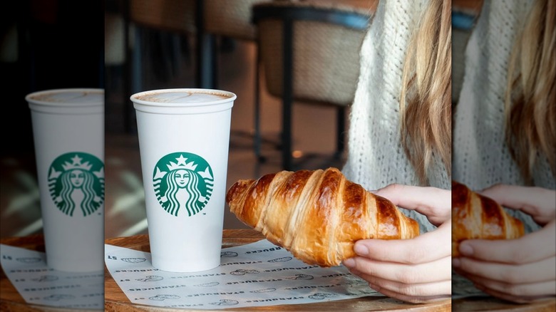 A person holds a Starbucks croissant.