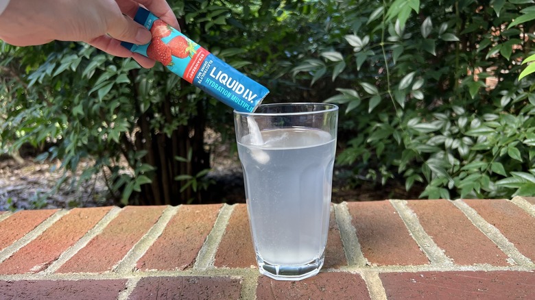 Pouring Liquid I.V. into glass