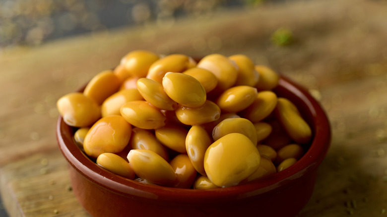 Lupini beans in red bowl