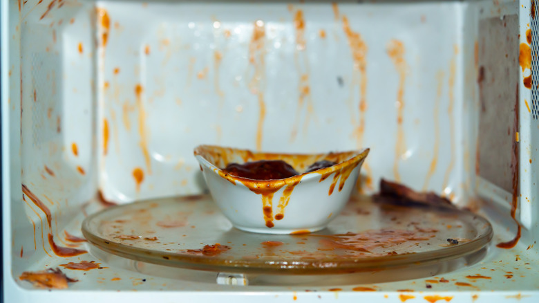 Exploded tomato sauce in microwave