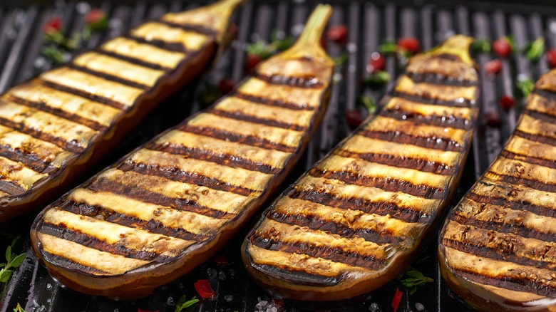 eggplant halves charred on the grill