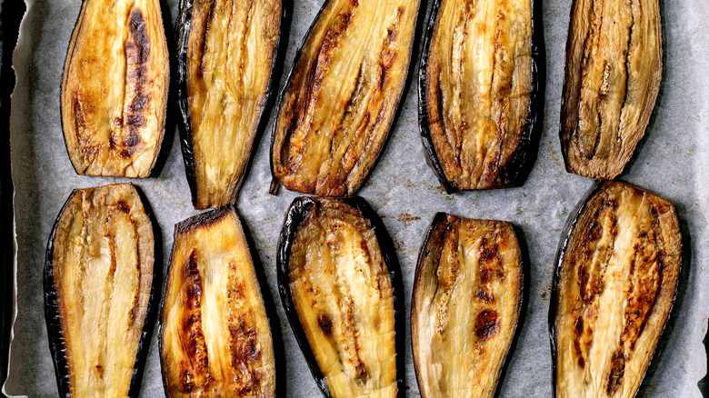 slices of roasted eggplants on parchment paper