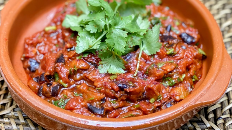 clay dish with moroccan zaalouk and cilnatro