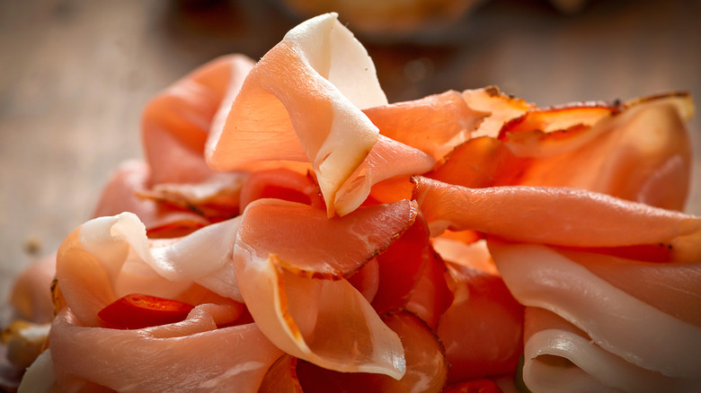 Close up of folded prosciutto slices