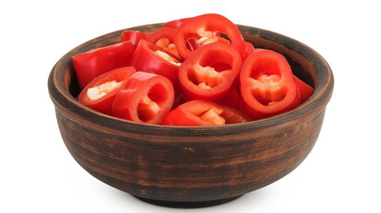 Sliced red chilis in a wooden bowl