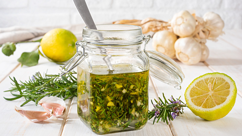 vinaigrette in jar with rosemary garlic lemon