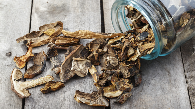 dried mushrooms on wood surface