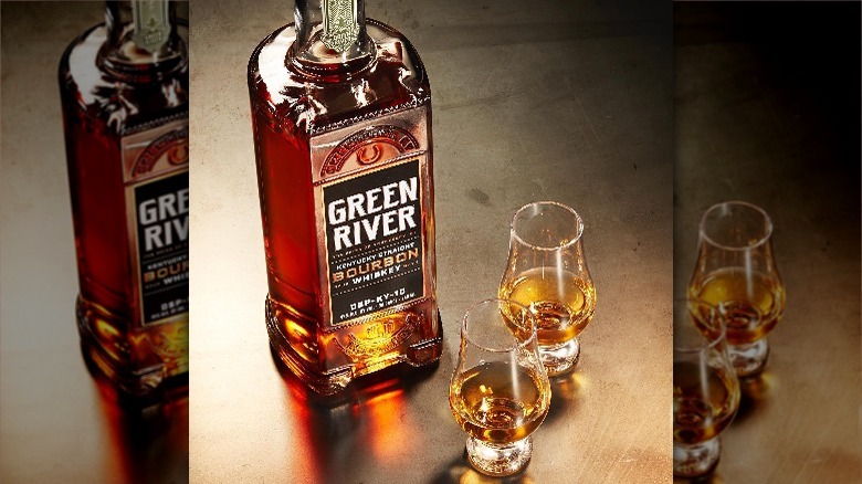 bottle and glasses of green river bourbon