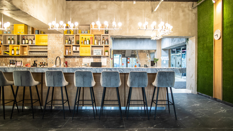 Bar with upholstered stools