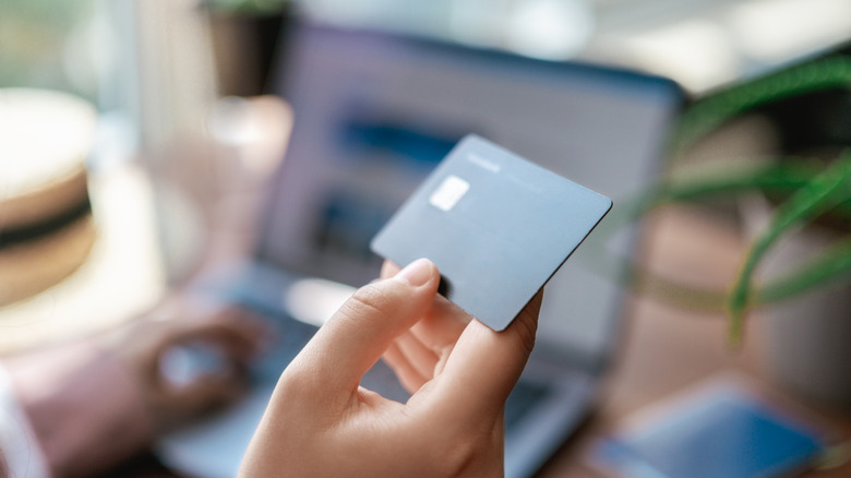 Woman holding a credit card