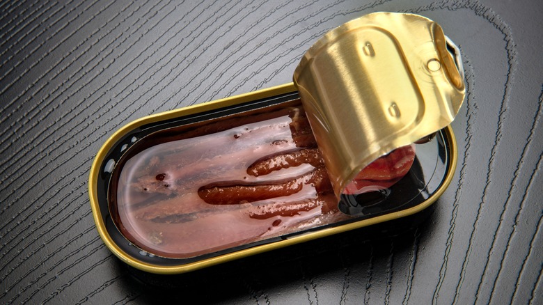 open tin of preserved anchovies