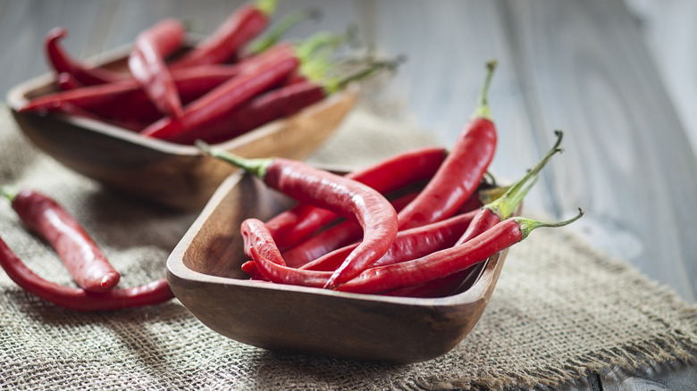 wooden bowls of fresh chilis 