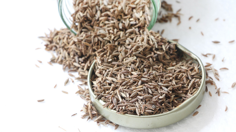 spilled cumin seeds on surface 