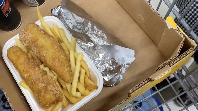 Order of Costco France's fish and chips in cardboard box with other food and drinks