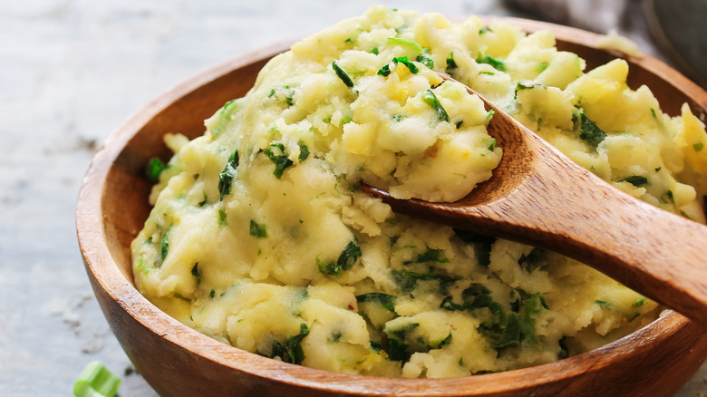 Mashed potatoes in wooden bowl