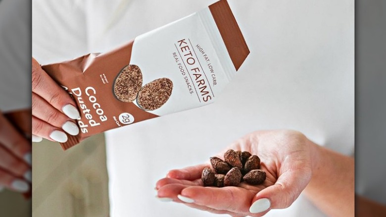 Woman holding Keto Farms almonds