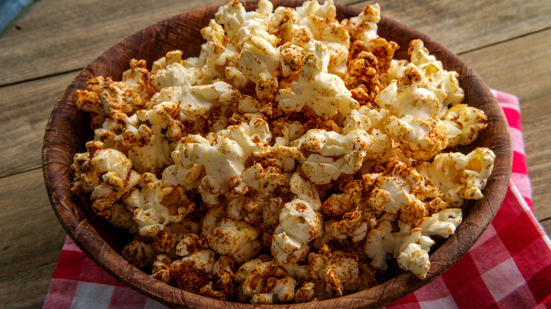 spicy popcorn in wood bowl