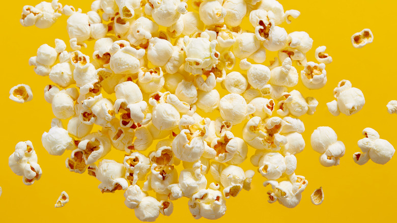 popcorn against yellow backdrop