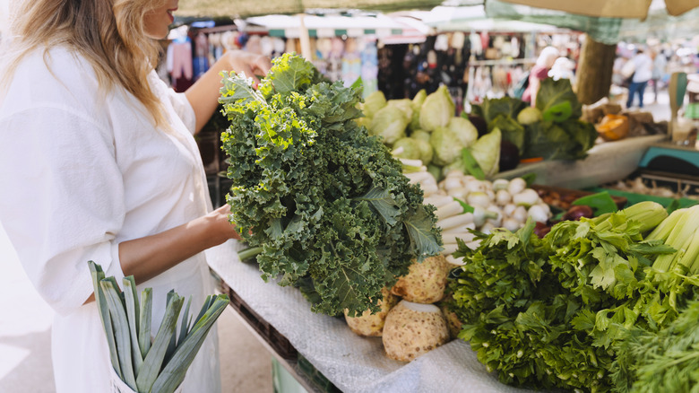 Woman shopping for kale