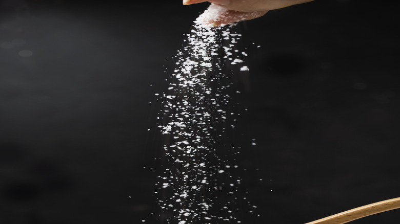 salt falling hand