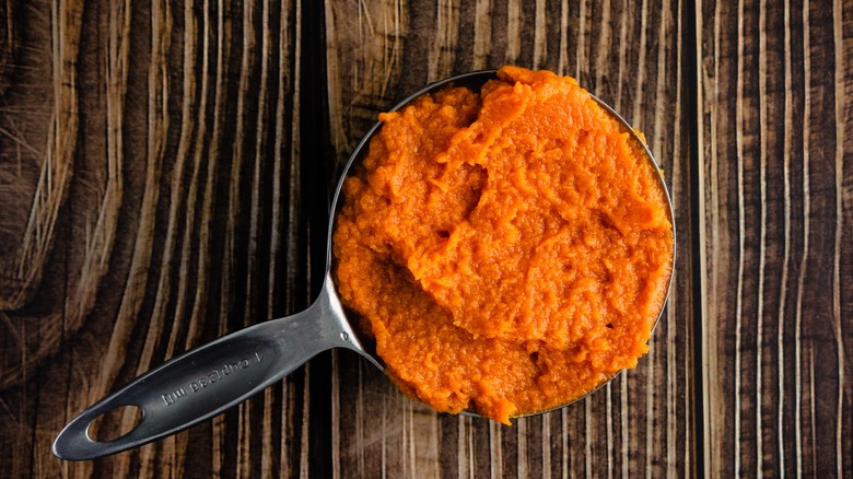 Overhead shot of one cup of pumpkin puree measured