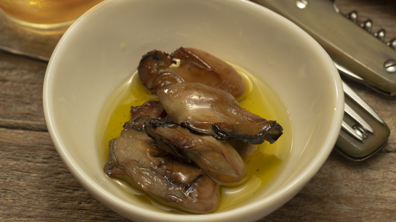 Smoked oysters in bowl