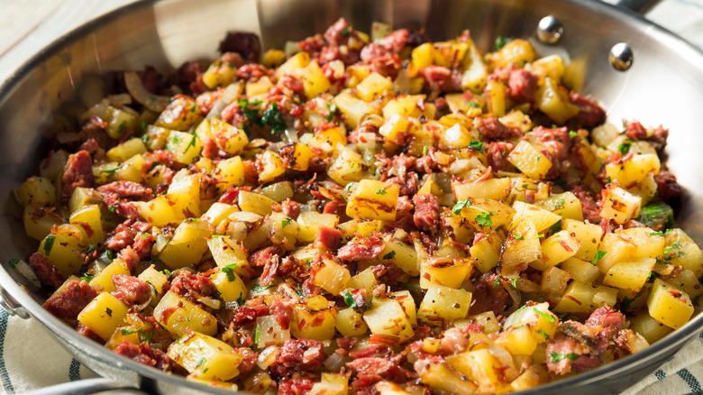 Corned beef hash in stainless steel pan