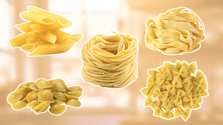 Five types of pasta on orange background
