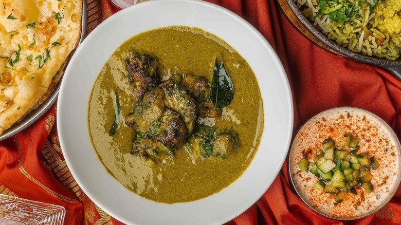 Aerial view of multiple plates of food served at Masala Zone in London
