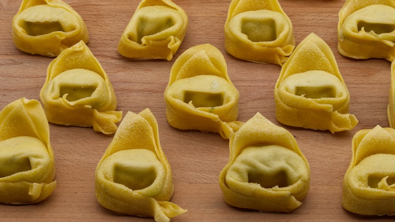 Tortelloni on wooden board