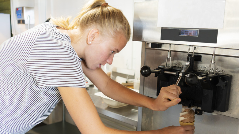 woman making soft serve cone