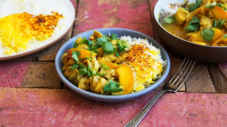 Peach and chicken stew on table