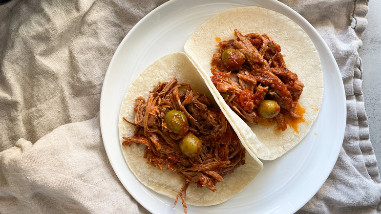 Ropa vieja tacos on a plate