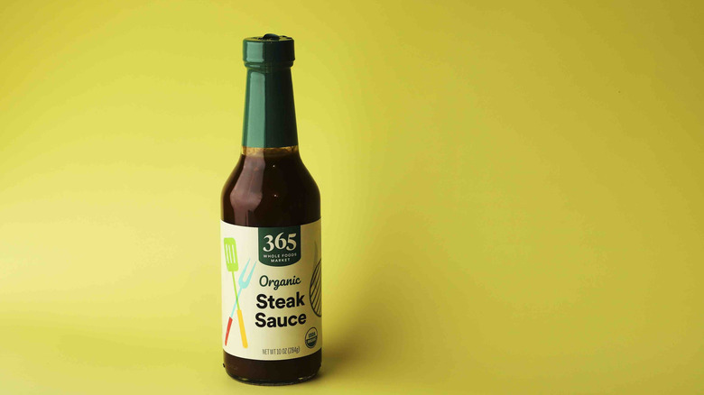 A bottle of Whole Foods' branded steak sauce is displayed.