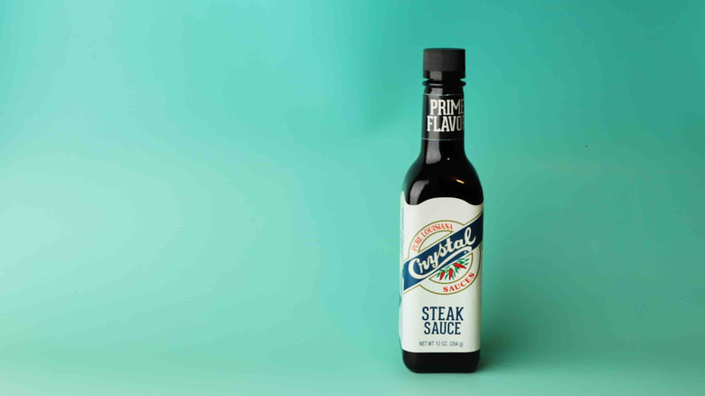 A bottle of Crystal steak sauce is displayed.