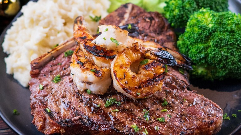 grilled porterhouse steak and sides from Black Angus Steakhouse