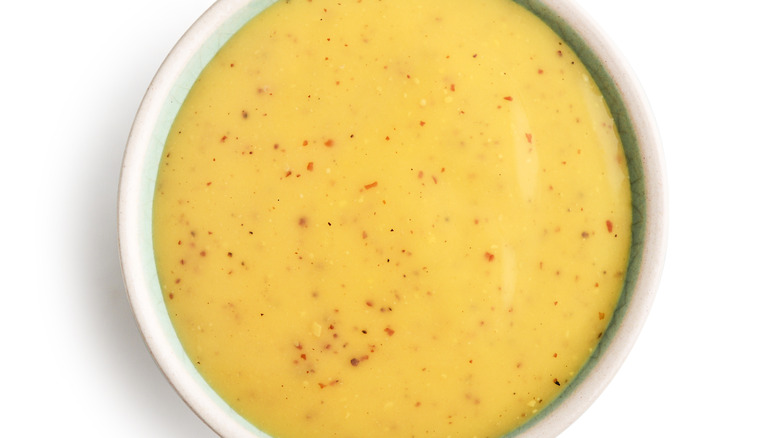 Honey mustard in white bowl