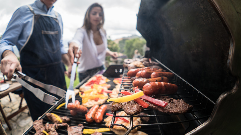 food on grill's warming rack