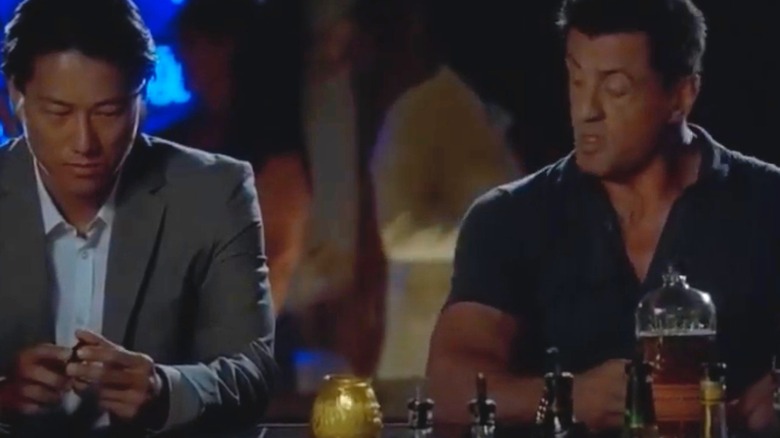 Sylvester Stallone drinking Bulleit bourbon in a bar in Bullet to the Head