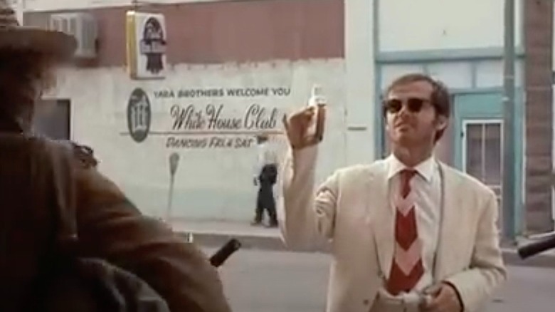A scene in Easy Rider where Jack Nicholson drinks Jim Beam in the street