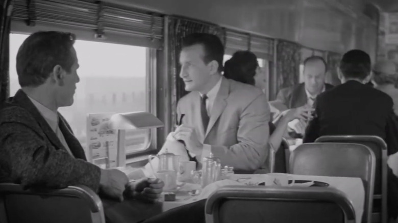 A scene from The Hustler of a two men sitting at a table