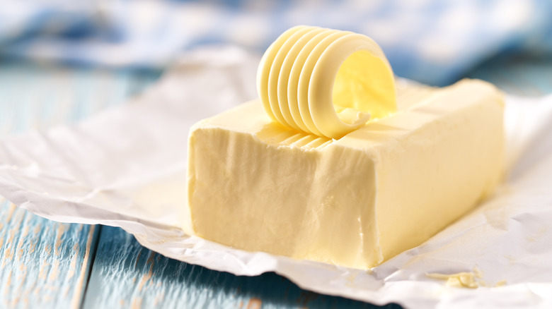 A slab of butter on a blurry background