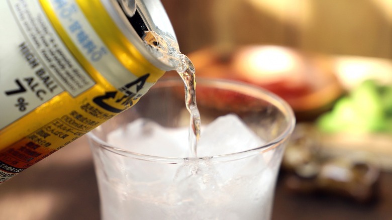 Canned cocktail being poured