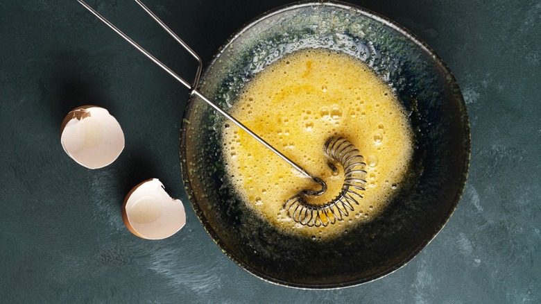 Beaten eggs with whisk