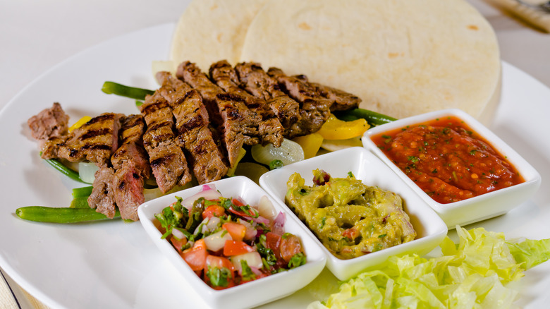 Steak fajitas with classic accompaniments