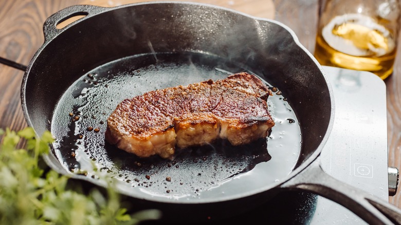 Steak in cast iron pan