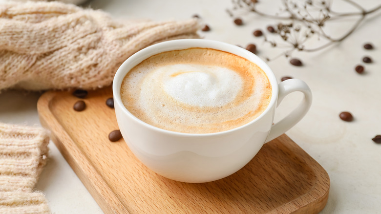 cappuccino on wooden board